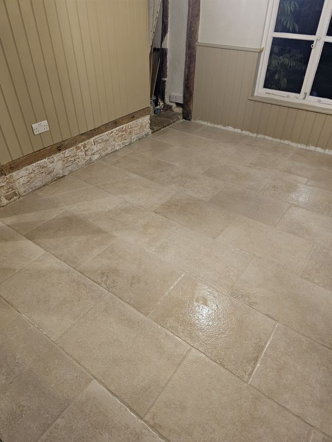 Flagstone floor laid beside an exposed timber frame