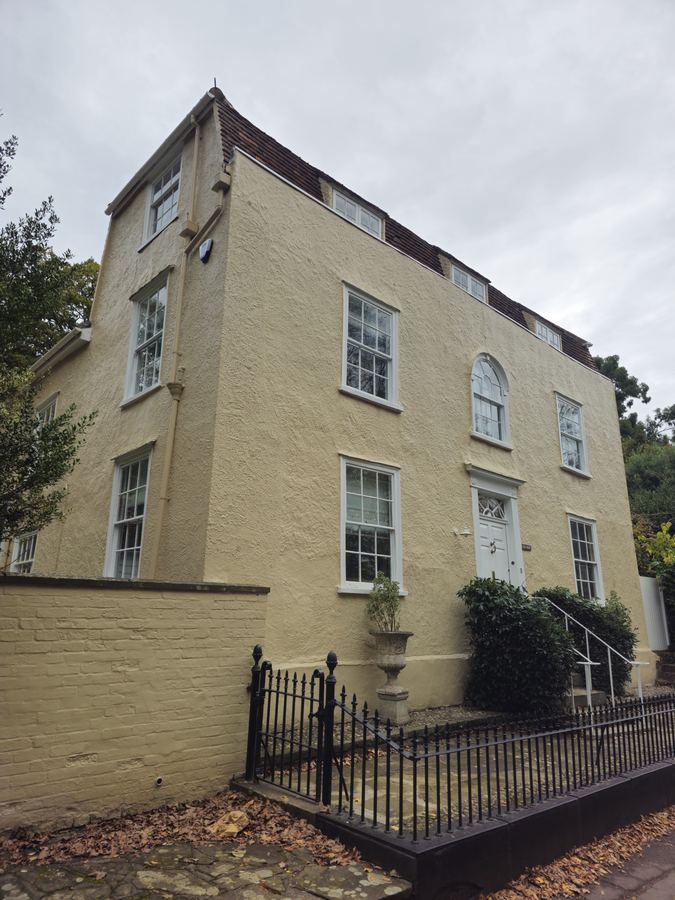 Rendered Georgian townhouse with iron railings