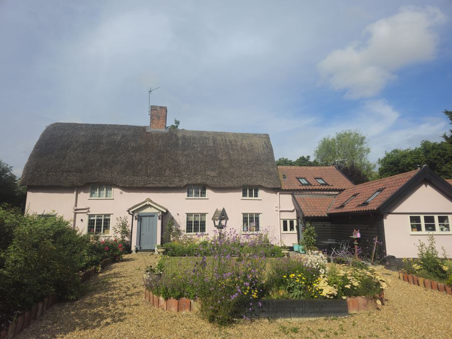 A long thatched range of period cottages