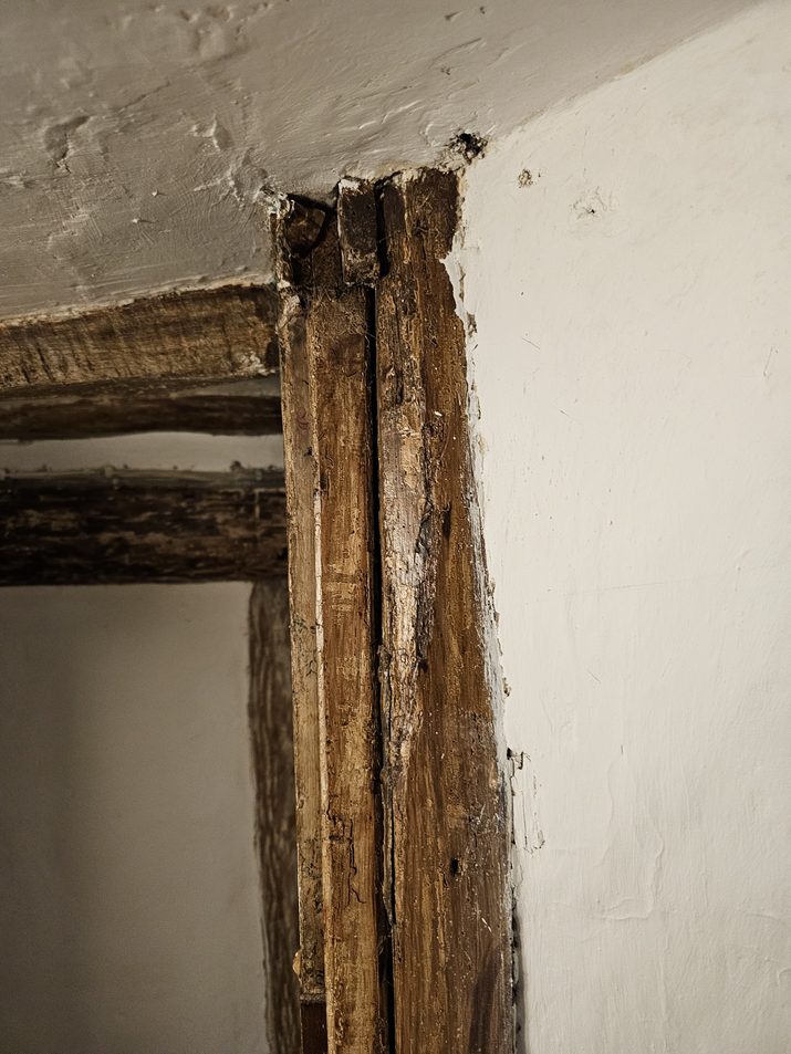 Decayed original timber post opened up for repair